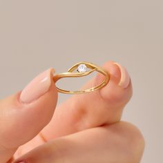 Ward off negativity and embrace style with this Diamond Minimal Evil Eye Ring. Crafted in 14k gold, this exquisite piece serves as a symbol of protection and good luck. The evil eye design features a bezel-set diamond at its center, adding a touch of sparkle to your daily look. Ring Details * 14k Solid Gold (also in 10k,18k ) * Band Options; Yellow Gold, White Gold Rose Gold * Band Width: 1.58 mm * Top Width: 4.61 mm * Thickness: 1.38 mm * Gemstone: Genuine White Diamond * Gem Color and Clarity: Stunning Diamond Rings, Evil Eye Design, Evil Eye Ring, Bezel Set Diamond, Rose Gold Band, Eye Ring, Eye Design, Bezel Diamond, Minimalist Rings