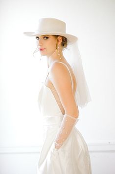 This soft beautiful hat provides the stylish and unique bridal detail , perfect for the wedding, bachelorette, or other bridal events! Info + Details: Diameter of the hat: about 34cm around                     Brim:  56-58cm                     Width of Brim:8cm                  Height:10cm Length of Veil: about 50cm Ivory color hat and tulle Hat brim is all woolen and not rigid backed May arrive pleated from shipping- can be ironed/steamed back into shape   ------------------------------------- Boho Bride Hat With Veil, Luxury White Boater Hat For Wedding, Wedding Hats For Bride Boho, White Veil Hat, Boho Hat With Veil, White Bridal Hats, Bride Boho Hat, Wedding Dress With Wide Brim Hat, Tulle Hat