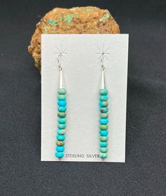 These unique turquoise rondelle earrings are strung in a loop like fashion and finished with gorgeous handmade sterling silver cones! A popular southwestern style earring! Earring Length: 2.5 Inches Total Earring Width: 5MM This item comes with a gift box! Same day shipping! Sterling Silver Turquoise Earrings, Silver Turquoise Earrings, Stick Earrings, Southwestern Style, Turquoise Earrings, Handmade Sterling Silver, Silver Turquoise, Turquoise Sterling Silver, Sterling Silber