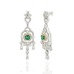 This is part of Chairish’s Fine Jewelry assortment.  Emerald and diamond chandelier earrings to make a statement with your look. These earrings create a sparkling, luxurious look featuring octagon cut gemstone. If you love to gravitate towards unique styles, this piece of jewelry is perfect for you.  PRODUCT DETAILS :-  > Material - 14K Solid White Gold > Gemstone - Emerald  > Gemstone Weight - 1.43 ct > Gemstone Shape - Octagon  > Gemstone Pcs - 2 > Gemstone Size - 5 x 5 mm > Diamond Weight - 4.58 ct > Diamond size - Mix  > Gross Weight - 11.742 Grams > Setting - Prong setting > Length - 53 mm  > Width - 15 mm Luxury Octagon Gemstone Earrings, Elegant Octagon Earrings For Formal Occasions, Elegant Octagon Gemstone Earrings, Elegant White Gold Octagon Earrings, Octagon-shaped Diamond Earrings For Formal Events, Formal Diamond Gemstone Chandelier Earrings, Octagon Diamond Earrings For Formal Events, Formal Octagon Diamond Earrings, Octagon Diamond Earrings For Formal Occasions