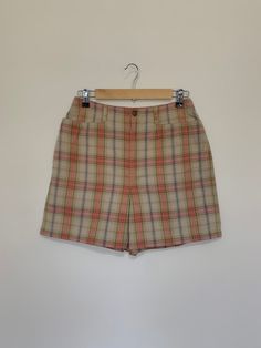 "Awesome high waisted 90's plaid shorts. High waisted fit, looser through the hips, and two front pockets. Button and zipper closure in front. Classic 90's multi colored plaid pattern. Shorts are in excellent clean condition. Measurements are taken zipped or buttoned up and laid comfortably flat then x 2 for total circumference (inches) Liz Claiborne Tag Size 10 100% Cotton Waist 28\" Hips 42\" Length 16.5\" Inseam 5\" Rise 12\" Bottom leg Opening Circumference 26\" All items are free of rips, t High Waist Plaid Summer Bottoms, 90s Style Shorts With Belt Loops, Retro Plaid Bottoms For Spring, High-waisted Plaid Bottoms With Built-in Shorts, Plaid Bottoms With Built-in Shorts, Retro Plaid Bottoms With Pockets, Plaid Bottoms With Built-in Shorts For Spring, Fitted Plaid Shorts, Plaid High-waisted Fitted Shorts