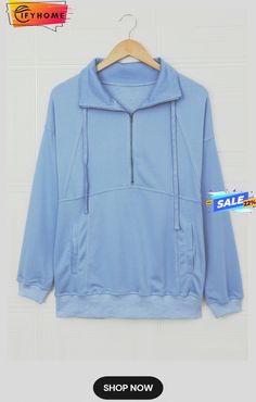 Cotton Pocketed Half Zip Pullover Sky Blue Sweatshirt Casual Blue Sweater With Pockets, Light Blue Streetwear Tops With Pockets, Blue Long Sleeve Sweater With Pockets, Blue Half-zip Hoodie For Fall, Casual Half-zip Top With Kangaroo Pocket, Oversized Blue Top With Kangaroo Pocket, Oversized Light Blue Hoodie Top, Light Blue Oversized Hoodie, Light Blue Winter Tops With Pockets