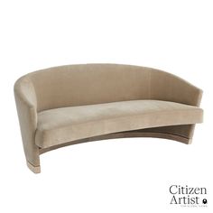 the curved couch is beige and sits on a white background with an inscription that reads citizen artist