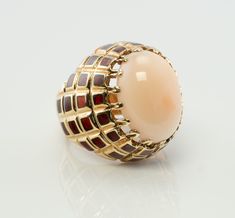 Angel Skin Coral Ring, Pink Coral Sea Coral Cocktail Ring, Red Enamel Ring, 18K Gold Ring, Oval Ring, Domed Ring, Elegant Ring, Estate Ring. This spectacular vintage ring is finely crafted in solid 18K Yellow Gold and set with a gorgeous Coral cabochon in the center. The angel skin pink Coral measures 18mm x 13mm. The stone is beautiful, with no sign of age. The red enamel is in excellent condition, no chips, no missing enamel. The top of the ring measures 25mm, the setting raises 15mm high abov Luxury Cabochon Dome Ring For Wedding, Luxury Dome Ring With Cabochon For Wedding, Yellow Gold Cabochon Dome Ring For Wedding, Wedding Dome Ring In Yellow Gold With Cabochon, Unique Yellow Gold Oval Dome Ring, Unique Oval Dome Ring In Yellow Gold, Fine Jewelry Yellow Gold Dome Ring With Cabochon, Fine Jewelry Dome Ring In Yellow Gold With Cabochon, Heirloom Yellow Gold Dome Ring With Cabochon