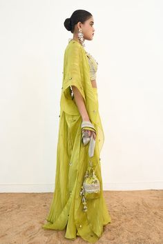 Lime green bustier featuring sequin and lace detailing. Paired with a solid gharara and a sequin embroidered cape. - Aza Fashions Green Pre-draped Saree For Eid Party, Green Festive Palazzo Set For Party, Festive Green Palazzo Set For Party, Chanderi Palazzo Set With Unstitched Blouse For Party, Green Chanderi Pre-draped Saree For Party, Pista Green Sharara With Unstitched Blouse For Party, Pista Green Pre-draped Saree With Sheer Dupatta For Party, Green Palazzo Saree Set For Festive Occasions, Green Palazzo Set For Navratri Party