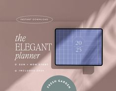 the elegant planner is on display in front of a pink wall with a green circle around it