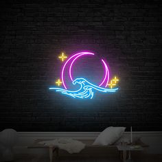 a neon sign that is on the side of a brick wall in a dark room