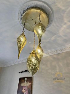 three hanging lights in the middle of a room