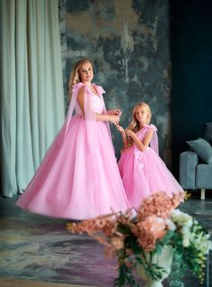 Pink mother daughter matching dresses for unforgettable moments! We are glad to welcome you in our atelier! We offer a complete set of matching dresses for a mother and daughter. All of the dresses in our shop are made based on your individual measurements. It is personally sewn by our seamstress on professional and modern equipment. We guarantee very high quality of sewing. We take into account all of your wishes when we craft our designs. They will fit and look much better than even the most e Mummy And Daughter Same Dress, Mother Daughter Matching Dresses, Mother Daughter Dresses, Baby Mum, Most Expensive Dress, Expensive Dresses, Mother Daughter Dresses Matching, First Birthday Dresses, Mother Daughter Dress