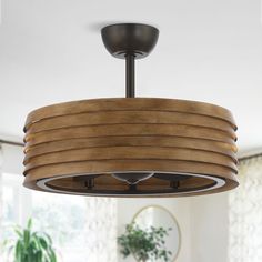 a wooden light fixture hanging from the ceiling