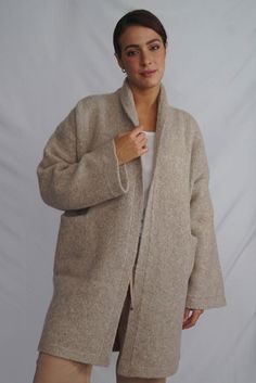 Wrap yourself in the warmth, comfort, and style of the Belen Alpaca Long Cardigan, a versatile knitwear piece designed to keep you warm and stylish throughout the seasons. Crafted from a luxurious alpaca blend, this cardigan/coat is elegant and sophisticated, making it perfect for both casual and dressier occasions. - Luxurious Alpaca Blend.- Fashionable and elegant design.- Practical pockets.- Versatile length that flatters all body types.- Vibrant and natural color options to suit your persona Womens Sweater Coats, Alpaca Coat, Knit Coat, Alpaca Cardigan, Capes & Ponchos, Cardigan Knit, Poncho Tops, Alpaca Sweater, Knitted Coat