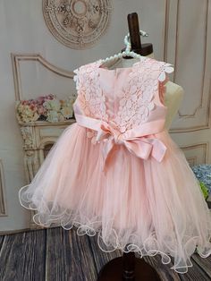 Delicate dress with high attention to detail. This design features embroidered flowers and three tulle layers for a puffy look. Dress is fully lined to ensure baby’s comfort. Works great as a flower girl dress or simply a wedding guest dress among many other special occasions.Fits true to size.Ships right away!#infant #princess #prettyinpink #comfort # baby girl #coming home outfit # first birthday dress # gift for baby # party dress # little lady #babygirlOccasion: Vintage princess gown perfect Pink Sleeveless Tutu Dress For First Communion, Pink Tulle Dresses With Appliques, Pink Tulle Dress With Appliques, Cute Floral Applique Tutu Dress For Dress-up, Cute Tutu Dress With Floral Applique For Dress-up, Pink Lace Dresses With Appliques, Pink Lace Dress With Appliques, Spring Princess Dress For First Communion, Pink Lace Tutu Dress For Baptism