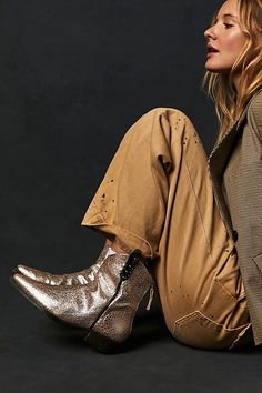 Your new go-to boot all season long, these western-inspired leather boots from our We The Free collection are featured in a short silhouette with square pointed toe and contrast sole for added dimension. * Back zip closure * Hand-stitched detailing throughout * Unique studded bottom sole * Specially designed side tabs **Fit tip:** This style runs true to size, if in between sizes; we suggest sizing up. **Please Note:** The leather is hand finished and each pair of boots is unique, what you recei Western Ankle Boots Outfit, Western Fashion Editorial, Desert Fashion Editorial, Bw Photoshoot, Boots And Shorts, Low Ankle Boots, Boots Outfit Ankle, Autumn Breeze, Tall Brown Boots