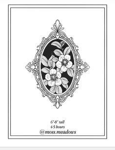 an ornate frame with flowers and leaves in black and white on the front cover of a card