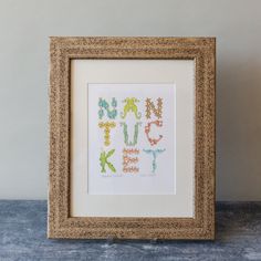 a cross stitch pattern in a frame with the word fun on it's side