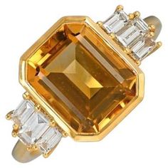 Elevate your style with this distinctive gemstone ring showcasing a bezel-set 3.30 carat emerald-cut natural citrine center stone. The shoulders are adorned with meticulously set baguette-cut diamonds, adding a touch of sophistication. Meticulously handcrafted in 18k yellow gold, this ring boasts a total approximate diamond weight of 0.42 carats. Ring Size: 6.5 US, Resizable Metal: Gold, Yellow Gold Stone: Diamond, Citrine Stone Cut: Emerald Cut Style: Art Deco Total Weight: 4.06 Grams Style Art Deco, Baguette Cut Diamond, Citrine Stone, Natural Citrine, Gold Stone, Baguette Cut, Art Deco Ring, Stone Cuts, Cocktail Ring