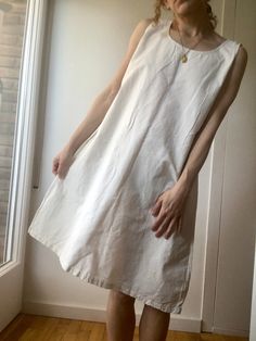 Antique / Vintage 1930s / 40s linen slip dress in off-white / ivory. Handsewn. Condition: Very good vintage condition, like never used before.  Measurements  No tag size. Will fit a range of sizes S-M-L Model is 1'65 cm tall and usually wears a size S Please let us know if you have any questions. It will be shipped within 48 hours with tracking number. RETURNS AND CANCELLATIONS: I gladly accept returns, exchanges, and cancellations Contact me within: 14 days of delivery Ship items back within: 14 days of delivery Request a cancellation: before item has shipped ----------------------------------------------------------------------------------------------------------------- white cotton dress, french antique linen, vintage cotton slip, vintage nightgown, edwardian dress cami, vintage summer Edwardian Nightgown, Linen Slip Dress, Market Dress, Edwardian Dress, Vintage Nightgown, Cotton Slip, Vintage Everyday, White Cotton Dress, French Antique