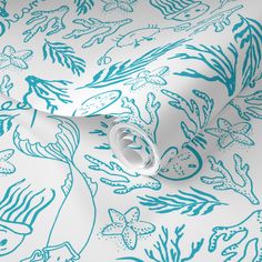 a blue and white wallpaper with sea life on it's surface, including an octopus