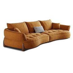 a brown couch with pillows on top of it