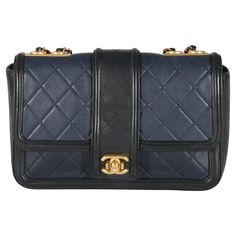 Listing Title: Chanel Navy Black Quilted Lambskin Medium Elegant CC Flap Bag SKU: 134683 Condition: Pre-owned Condition Description: A timeless classic that never goes out of style, the flap bag from Chanel dates back to 1955 and has seen a number of updates. The design was revolutionary for its time, giving its wearers the freedom to carry their everyday must-haves without the cumbersome nature of a larger bag. The bag features the classic leather-entwined chain-link shoulder strap for a distin Country Italy, Navy Chanel, Chanel Shoulder Bag, Chanel Model, Black Quilt, Large Bag, Classic Leather, Flap Bag, Black Handbags