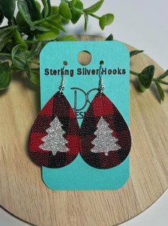 Christmas Earrings, Red Plaid Christmas Tree Cutout Teardrops. These lightweight earrings are a perfect accessory to your Christmas Holiday outfits. Made of faux leather with Sterling Silver hooks are suitable for sensitive earrings. *color and pattern may vary due to nature of leather and lighting Holiday Faux Leather Earrings, Faux Leather Christmas Earrings, Red Plaid Christmas Tree, Christmas Faux Leather Earrings, Tree Cutout, Red Plaid Christmas, Leather Christmas, Cricut Christmas Ideas, Cricket Projects