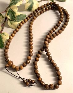 Natural Agar Wood Dark 108 beads Mala Prayer Rosary Necklace Bracelet Buddhist 108 Beads, grams 46 grams size 9mm Yoga Mantra Handmade Agarwood is a fragrant dark resinous wood used in incense, perfume, and small carvings. First-grade agarwood is one of the most expensive natural raw materials in the world,[4] with 2010 prices for superior pure material as high as US$100,000/kg, although in practice adulteration of the wood and oil is common, allowing for prices as low as US$100/kg One of the ma Incense Perfume, Buddhist Rosary, Buddhist Beads, Mala Beads Bracelet, Yoga Mantras, Beads Mala, 108 Mala Beads, Rosary Necklace, 108 Bead