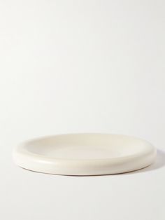 a white plate sitting on top of a table