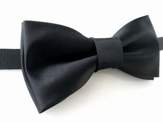 "E.Lash - Lithuanian designer specializing in handmade bow ties, pocket squares, cufflinks, earrings and other accessories since 2013. * Bow tie material: silk; * Bow tie adjustable black velvet strap; * Handmade; * Brand new; * Type: pre-tied; * Accessories are packaged in stylish gift box; * E.Lash accepts custom and wholesale orders also (please contact E.Lash). * Could match pocket square also. Pocket square from over 500+ various colors and materials is available (please contact E.Lash orde Classic Black Bow With Butterfly Knot, Classic Black Butterfly Knot Bow, Black Bow Tie With Butterfly Knot For Business, Black Butterfly Knot Bow Tie For Business, Black Butterfly Knot Bow Tie, Elegant Black Ties With Butterfly Knot, Dapper Butterfly Knot Bow Tie For Black-tie Events, Elegant Black Tie With Butterfly Knot, Elegant Black Bow With Butterfly Knot