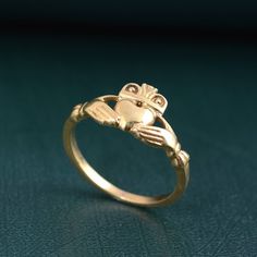 Dainty Claddagh Celtic Irish Ring, Claddagh ring, Claddagh Ring heart hand ring, Gift for her, promise ring, Friendship Ring, love ring, gift Metal:- Brass ✦ Our rings are made of high-quality Brass metal and are carefully crafted by hand in our family workshop. The brass metal will develop a nice antique color over time. So, I suggest cleaning it once in a while for getting back to the shiny original color. You can use natural ingredients like lemon or vinegar with water to clean it. Also, appl Symbolic Promise Jewelry For Valentine's Day, Symbolic Jewelry For Promise On Valentine's Day, Heirloom Heart Ring As Gift, Symbolic Heart Shaped Rings As Gifts, Symbolic Heart-shaped Rings For Valentine's Day, Symbolic Heart Ring For Valentine's Day Gift, Heirloom Heart-shaped Rings For Gifts, Symbolic Gold Heart-shaped Ring, Vintage Gold Jewelry For Proposal