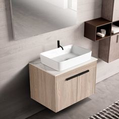 a bathroom with a sink, mirror and shelving unit on the wall above it