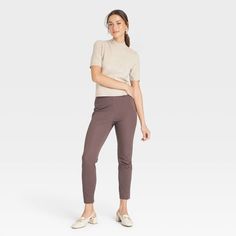 You'll never tire of dressing up or dressing down the High-Rise Skinny Ankle Pants from A New Day™ for versatile looks any day of the week. Crafted from cotton with spandex, these high-rise skinny pants will keep you comfy from day to night and season to season. The pull-on pants offer you a figure-flattering look, and they skim the ankles, letting you show off your stylish footwear. The pull-on pants are finished with a side hook and zipper for a secure fit with a sleek look. Wear them with any Fall Workwear Leggings, Ankle-length, Fall Workwear Ankle-length Leggings, Fitted Capris For Workwear In Fall, Fitted Capris For Fall Workwear, Fitted Ankle-length Capris For Fall, Mid-rise Capris For Fall Workwear, Stretch Cropped Leg Pants For Fall, Workwear Capris With Pull-on Style, Fall Stretch Cropped Leg Pants