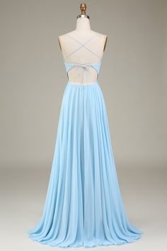 a light blue dress is on display in front of a mannequin