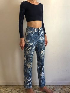 Amazing blue floral 1980s Kenzo Jeans!Great all over mega lush flower print. Classic jeans style. Medium weight cotton denim. Five pockets. Five button front fly (all the buttons have the Kenzo face!)Kenzo face patch on back pocket.Leg has just the slightest taper. Label Kenzo Jeans, Miyuki, size US28, 100% cotton, please wash cool delicate and drip dry. Very good vintage condition with no fabric or sewing flaws. Print looks vintage and a bit faded however I believe this is fully intentional. Me Relaxed Fit Floral Print Cotton Jeans, High Rise Floral Print Denim Bottoms, Fitted Denim Blue Bottoms With Floral Print, Fitted Denim Blue Floral Print Bottoms, Spring Denim Blue Bottoms With Graphic Print, Relaxed Fit Floral Print Denim Jeans, Relaxed Fit Floral Print Jeans In Denim, Relaxed Fit Floral Print Jeans, High Waist Floral Print Denim Jeans