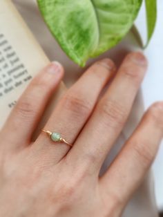 ✨ Dainty Light Green Jade Ring for Women ✨14K Gold Filled, Rose Gold Filled, Sterling Silver Wire Wrapped Tiny gemstone Ring💚 Simple stackable ring with a genuine green Jade, the good-luck stone. Jade is believed to bring protective, lucky-charm energy to the wearer 💚Sizing:• Gemstone Diameter: 4 mm• Ring Band: 0.8 mm • Handmade in your ring size with natural gemstone beads. • Dainty & cute. The ring is slim and petite, yet durable to wear daily. • Gold-filled is known for its lasting quality. Jade Wedding Ring Women, Simple Ring With Stone, Daily Wear Rings For Women, Jade Rings For Women, Jade Engagement Ring, Natural Stone Rings, Green Jade Ring, Jade Wedding, Jade Rings