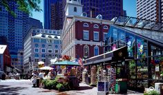 an outdoor market in the middle of a city