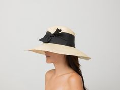 Aguacate Extra Long Brim Hat with Twist Bow 100% Toquilla straw. This natural fiber is known for its quality and beauty. The perfect beach-to-city accessory. Each hat takes approximately two to three days to weave by hand by our Ecuadorian artisans, and after pressed for shape. Indulge in luxury with our Aguacate Extra Long Brim Hat. Handmade with toquilla straw, this hat features a stylish twist bow for a sophisticated touch. Stay protected from the sun in style and elevate your look with this Elegant Adjustable Straw Hat With Upf 50+, Chic Cream Toquilla Straw Boater Hat, Elegant Straw Hat With Upf 50+, Chic Cream Straw Hat, Black Toquilla Straw Panama Hat For Summer, Elegant Straw Panama Hat With Upf 50+, Elegant Panama Straw Hat With Upf 50+, Palm Leaf Sun Hat For Travel, Elegant Toquilla Straw Fedora For Beach