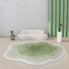 a living room with green and white decor on the floor, couches and rugs