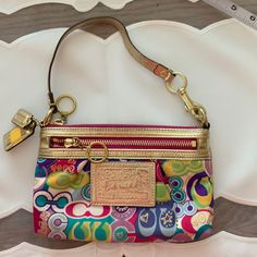 Looks Brand New. See Pictures. Multicolor Rectangular Coach Shoulder Bag, Coach Multicolor Rectangular Bag, Multicolor Rectangular Coach Bags, Multicolor Coach Pouch Bag, Multicolor Retro Coach Bag, Multicolor Coach Bag With Zipper Closure, Chic Coach Bag With Zipper Pouch, Multicolor Rectangular Bag With Gold-tone Hardware, Multicolor Coach Crossbody Bag