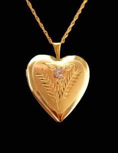 "A touching gift from the heart. There is room inside for those favorite pictures of your loved ones past or present. IT is 14kt yellow gold , . This has the original celluloid clear sleeves that go over the photos too. All original. The 14kt gold chain is 16\" and original to the locket.  See photos for size, condition and more views.  4-1-21" Elegant Locket Necklace For Valentine's Day Anniversary, Heirloom Heart-shaped Jewelry With Hallmark, Heirloom Keepsake Jewelry For Valentine's Day, Elegant Heart Cut Locket Necklace For Wedding, Gold Heart Necklace Stamped 14k For Wedding, Heirloom Locket Necklace For Valentine's Day, Heirloom Heart Charm Locket Necklace For Wedding, Heart Cut Locket Necklace For Wedding, Heirloom Heart Locket Necklace For Valentine's Day