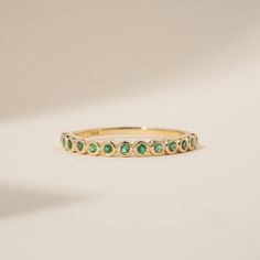 Arleth Timeless, elegant & dainty, this rich shade of green will make you feel like royalty each time you gaze at your hand! This can be your vibrant and unique wedding band, yet also the perfect dainty ring to add a pop of color to your solid gold ring stack. Emeralds fill ½ of the band. Choose your metal and size, and we will make it custom for you. May’s birthstone, this is a stunning ring to stack with your wife’s wedding ring! - Handmade- Solid Gold- Natural Emerald- Total Emerald Carat Wei Push Present Ring, Unique Wedding Band, Solid Gold Ring, Ring Stack, Half Eternity Band, Unique Wedding Bands, Half Eternity Ring, Gold Ring Stack, Solid Gold Rings