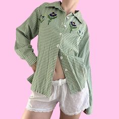 Vintage Green Gingham Floral Embroidered Button Up Blouse Shirt  Button closure with long sleeves.  Brand - National  Tag size - Large Seen on size Small pinned Measurements (laying flat) Chest - 22.5 in Length - 24.5 in #fairygrunge #whimsygoth #ginghamblouse #cottagecore #babydollshirt Spring Embroidered Green Shirt, Spring Green Embroidered Shirt, Green Embroidered Shirt For Spring, Green Embroidered Button-up Shirt, Spring Gingham Cotton Shirt, Green Embroidered Collared Shirt, Spring Cotton Gingham Shirt, Spring Plaid Shirt With Placket, Long Sleeve Gingham Shirt With Button Closure