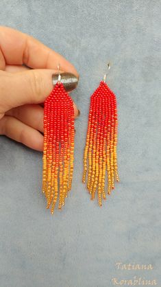 These handmade earrings are made of high-quality Czech beads and strong synthetic thread. They are elegant, fashionable, and highly versatile, suitable for everyday wear. Color: red, orange. There may be some color discrepancies which is due to the different monitor settings 100% hand made with love! Measurements: Length-about 11cm (4.3 inch) Width -about 2 cm (0.79 inch) Materials: Sterling silver components Czech glass beads Strong bead weaving thread Red Tassel Earrings With Round Beads As Gift, Adjustable Red Handwoven Earrings, Handwoven Red Earrings, Handmade Red Tassel Earrings With Round Beads, Orange Tassel Earrings With Colorful Beads As Gift, Handmade Red Beaded Earrings For Summer, Red Fringe, Orange Earrings, Earrings Red