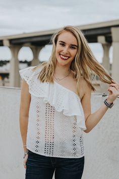 Eyelet one shoulder top featuring the cutest ruffle detail! Maddie is wearing a size smallLightweightThis item is final sale. Skirt Shorts Outfit, Parking Garage Photoshoot, Garage Photoshoot, Katy Texas, Boutique Gifts, Skirt Shorts, Shorts Outfit, One Shoulder Top, Parking Garage