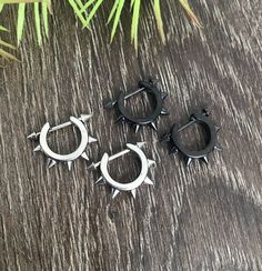 Edgy Hoops with double spikes screw closure earrings  are made of 316L Stainless steel.Very easy to use and look very cool on. You can use it on ear lobe, second piercings and cartilage.Post is  1mmPost length 6mmHoop inner diameter 10mmListin for 1 pair (2 earrings)All items are shipped in a gift box Edgy Stainless Steel Hoop Earrings, Edgy Hoop Cartilage Earrings, Punk Metal Hoop Piercings, Second Piercings, Jewelry Hoop Earrings, Spike Hoop Earrings, Earrings Gothic, Second Piercing, Punk Earrings