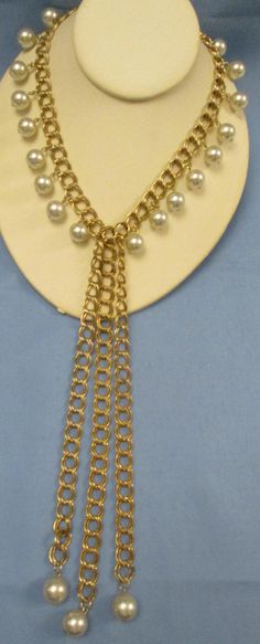 Never Worn vintage signed Park Lane comfortable heavy in weight bib choker necklace. Gold-tone metal double large chain linked chocker triple dangling double chains with a dangling pearl at each end. Choker has dangling pearl along its entire length. Round slide in type clasp tag signed Park Lane. There are 2 links where some of the goldtone has come off, it is barely noticeable unless you really look for it, this may be due to age, time and storage. Choker Length 17 inches. 1st) Length dangle chain including faux pearl 9 & 1/4 inches. 2nd) 8 & 7/8 inches. 3rd) 8 & 1/2 inches. I offer combined shipping discounted charges. Vintage Metal Dangle Chain Necklace, Vintage Metal Pearl Chain Necklace, Vintage Metal Chain Necklace For Party, Metal Chain Choker In Costume Jewelry Style, Vintage Double Chain Metal Necklace, Vintage Metal Chain Choker, Vintage Gold Chain Choker Necklace, Vintage Metal Chain Necklace With Adjustable Chain, Vintage Chain Link Necklace For Party