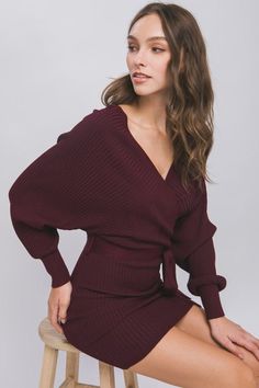 This Wine Off Shoulder Wrap Belted Ribbed Knit Dress is a timeless choice for casual occasions. Crafted from a lightweight ribbed knit fabric, it features an off shoulder design with a relaxed fit, an adjustable removable self tie belt, a front surplice wrap detail and a mini length bodice. Fabric & fit: 83% Viscose, 17% Polyester Model is wearing size Small Off Shoulder Design, Knit Wrap Dress, Pepper Color, Shoulder Wrap, Wrap Belt, Ribbed Knit Dress, Shoulder Design, Tie Belt, Black Media