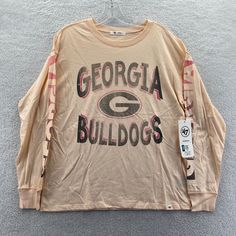 New '47 Brand Georgia Bulldogs Uga Long Sleeve T-Shirt Women's Large The Tag Says Small Since It Is Intended To Be Worn Really Loose, But Will Fit A Women's Large Normally. Just Double Check Your Measurements At Home Then Check The Measurements I Posted Of This Shirt New With Tags In Excellent Condition Measurements Are Posted For You To Look At Within The Listing Photos Enjoy Lightning Fast Shipping Message Response Times I Ship Items Every Day, You Can Expect Your Order To Be Sent Out Within 1 Collegiate Soft-washed Tops For Streetwear, Collegiate Style Soft-washed Tops For Streetwear, Casual Relaxed Fit Tops With Team Logo, Bulldogs Shirt, Georgia Bulldogs Shirt, Blouse Cartoon, Red And Black Flannel, College Apparel, Bulldog Shirt