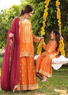 Description Shirt : Orange raw-silk shirt with Embroidery. Trouser : Orange raw-silk Gharara with Embroidery. Dupatta : Reddish maroon chiffon dupatta. Festive Long Sleeve Chinon Sharara, Festive Dabka Sharara In Georgette, Festive Georgette Sharara With Dabka, Festive Georgette Sharara With Dabka Details, Eid Sharara With Straight Kurta In Jamawar, Festive Shantoon Sharara With Dabka, Festive Shantoon Sharara With Dabka Details, Eid Sharara With Dabka In Chinon, Eid Shantoon Palazzo Set