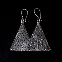 Hammered Hilltribe silver triangle earrings Approximately L 2" X W 1.25 " HillTribe SilverBecause of the high content of pure silver, these pieces are less likely to cause irritation to sensitive skin. This silver also tarnishes a bit slower which adds to its appeal as a low maintenance piece of jewellery. Sterling Silver Triangle Earrings For Pierced Ears, Nickel Free Triangle Sterling Silver Earrings, Nickel-free Triangle Sterling Silver Earrings, Silver Triangle Metal Jewelry, Sterling Silver Triangle Jewelry With Matching Earrings, Unique Triangle Sterling Silver Jewelry, Bohemian Triangle Nickel-free Earrings, Nickel-free Triangle Sterling Silver Jewelry, Nickel Free Triangle Metal Earrings