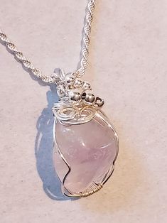 This is a natural Rose Quartz Crystal, tumble polished. Beautifully wire wraped with 925 Sterling Silver.  Rose quartz is known as a healing crystal and the stone of unconditional love. It's believed to emit strong vibrations of love, which are thought to:     - support emotional and relationship healing     - inspire compassion     - boost feelings of peace and calm Purchase just the pendant or add the Necklace.  IN STOCK - ships in 1-2 days -  Gift Box Included.  Details:  Pendant : Natural Ro Spiral Wire Wrapped Sterling Silver Necklace, Spiral Pink Jewelry For Gifts, Pink Spiral Jewelry For Gifts, Sterling Silver Hand Wrapped Necklace For Gift, Silver Freeform Wire Wrapped Jewelry, Handmade Silver Freeform Jewelry, Handmade Oval Rose Quartz Jewelry, Unique Hand Wrapped Silver Plated Wire Necklace, Elegant Amethyst Necklace Hand Wrapped